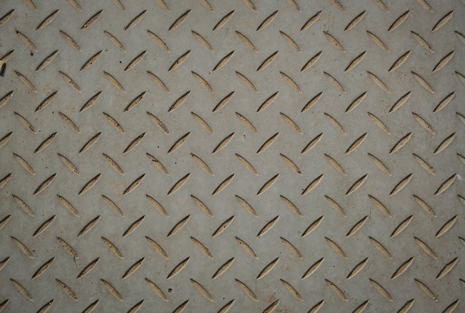 Close-up of brushed stainless steel surface finish and metal texture